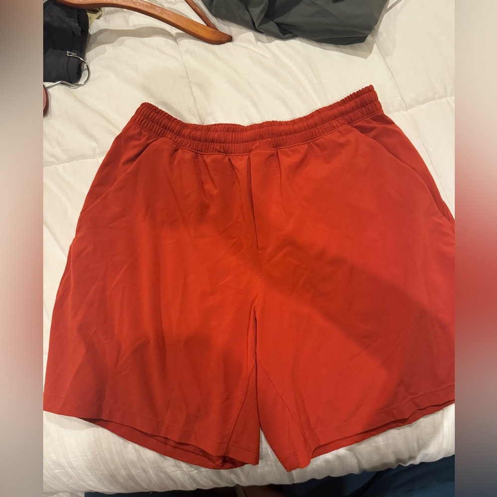 LULULEMON LINERLESS BURNT ORANGE SHORTS